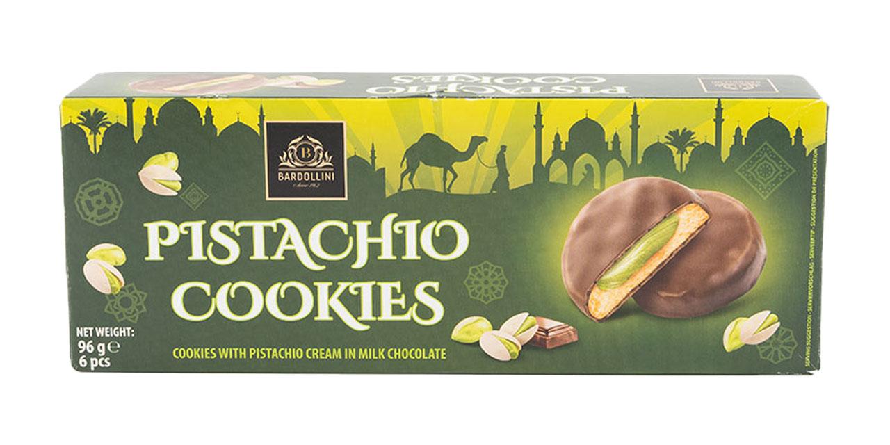 Die Verpackung der Pistachio Cookies in grünem Design vor weißem Hintergrund. 