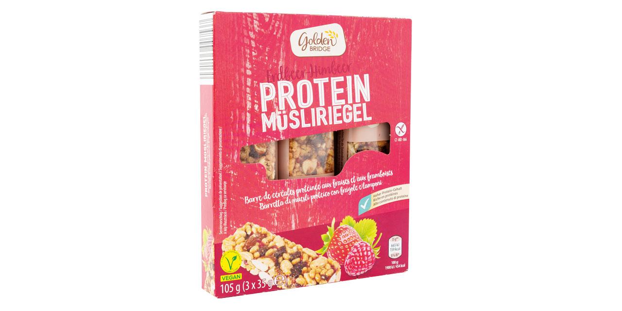 Rote Verpackung mit Müsliriegel, Erdbeere und Himbeere auf der Vorderseite der Packung