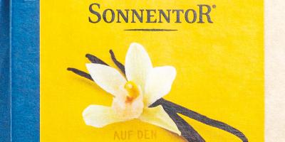 Packungsvorderseite: weiße Vanilleblüte