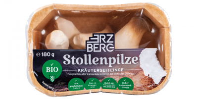 Erzberg Stollenpilze Kräuterseitlinge: Papierpackung mit Pilzen, sichtbar durch Klarsichtfolie.