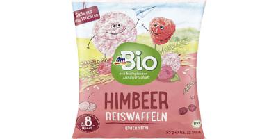 Plastikbeutel in Rosa mit einer Himbeere und einer Reiswaffel