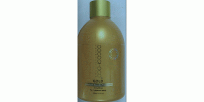 Goldfarbene Kunststoffflasche als Behälter für Haarpflege