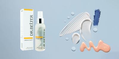 Das Produkt Dr. Belter Silver Spray vor blauem Hintergrund und neben diversen Farbkleksen.