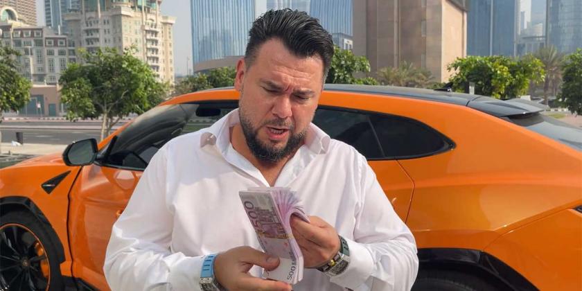 Koko Petkov in Dubai in front of expensive car and a staple of 500 Euro notes