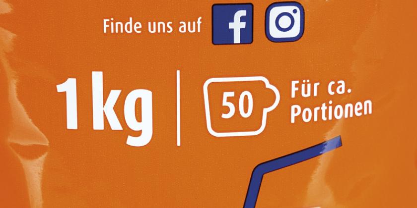 Ovomaltine Der Klassiker: 1 kg ist die Füllmenge, weiße Schrift auf orangem Hintergrund. 1 kg war der frühere Inhalt.
