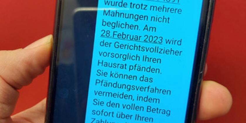 Fake SMS message allegedly from the tax office threatening seizure if not paid in