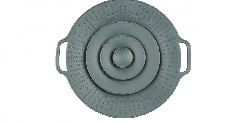 Spritzschutz in grauer Farbe mit zwei seitlichen Griffen