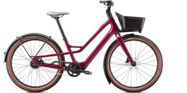 dunkles Damenfahrrad mit Korb vorne von der Seite fotografiert