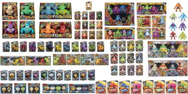 EIne Unmenge an kleinen sandgefüllten Plastikspielzeugen in Form von Dinosauriern oder Monstern usw.