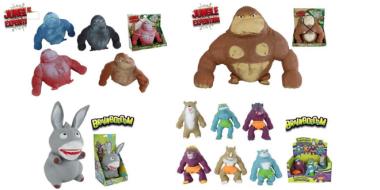 Auf dem Bild sind verschiedene bunte Spielfiguren zu sehen, die an tierische oder monsterähnliche Charaktere erinnern. Links stehen mehrere kräftig gebaute Kreaturen in Rot, Blau, Grau und Beige. Rechts befindet sich eine größere braune Figur mit breiter Brust. Unten sind weitere fantasievolle Figuren in unterschiedlichen Farben und Formen abgebildet, einige mit Verpackungen im Hintergrund.