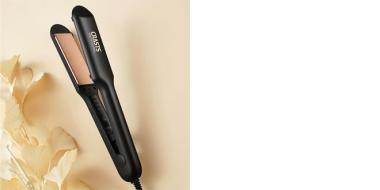schwarzes Glätteisen für die Haare auf hellem Untergrund