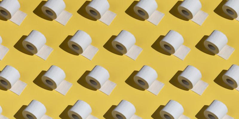 Grafik von Klopapierrollen, die auf gelbem Feld in vier Reihen nebeneinanderliegen