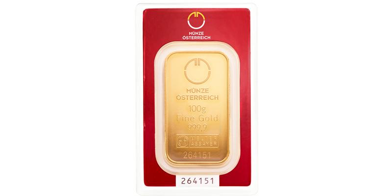 Gold kaufen - Edelmetall als Anlage: 100-Gramm-Goldbarren der Münze Österreich in roter Verpackung mit Sichtfenster