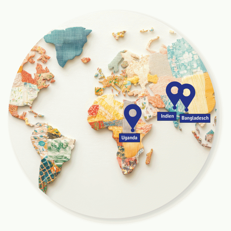 Weltkarte aus Stoff mit Pins in Uganda, Indien und Bangladesch