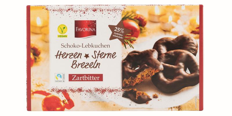 Schoko-Lebkuchen in quaderförmiger Kartonverpackung in heller, weihnachtlicher Aufmachung mit je einem abgebildeten Stern-, Breze- bzw. Herzlebkuchen