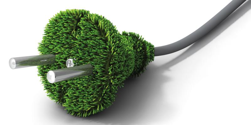 Grüner Stromstecker mit grauem Kabel