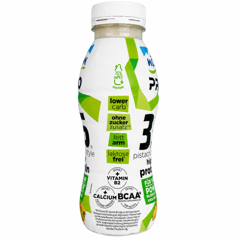 „NÖM PRO 35" Pistachio Style, Seitenansicht der Flasche mit den Claims „lower carb", „ohne Zuckerzusatz", „fettarm" und „laktosefrei" sowie Hinweisen auf Vitamin B2, Calcium und BCAAs, 7.000 Milligramm pro 350 Gramm.