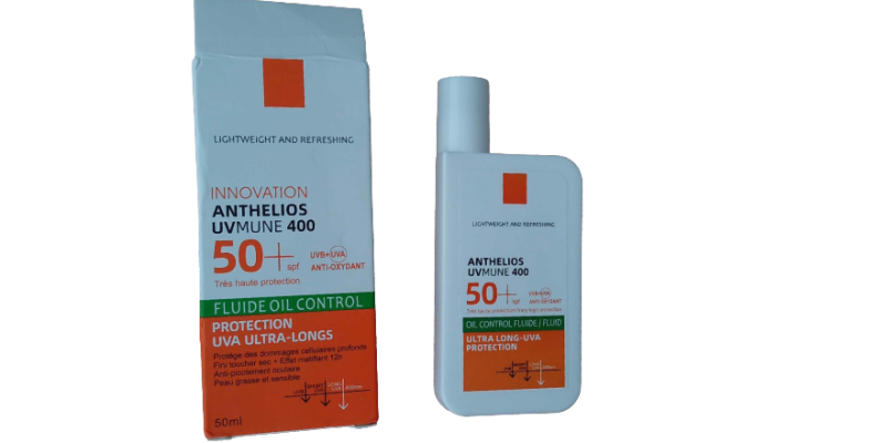 Weiß-orange Kunststoffflasche für Sonnencreme und ebensolch gestalteter Überkarton.